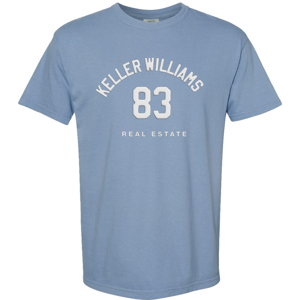 Blue t-shirt with 'Keller Williams Real Estate 83' text on a white background