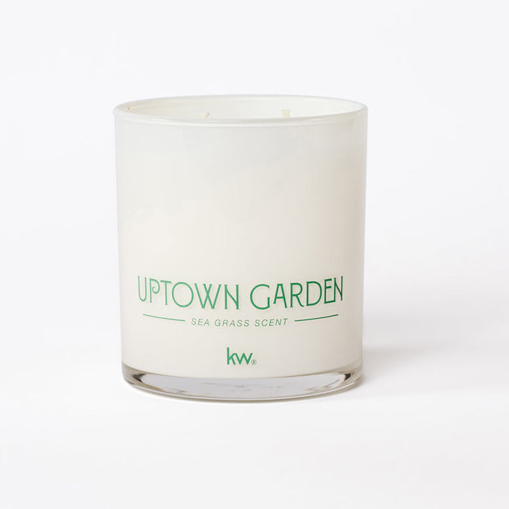 Candle with 'Uptown Garden' text on a white background