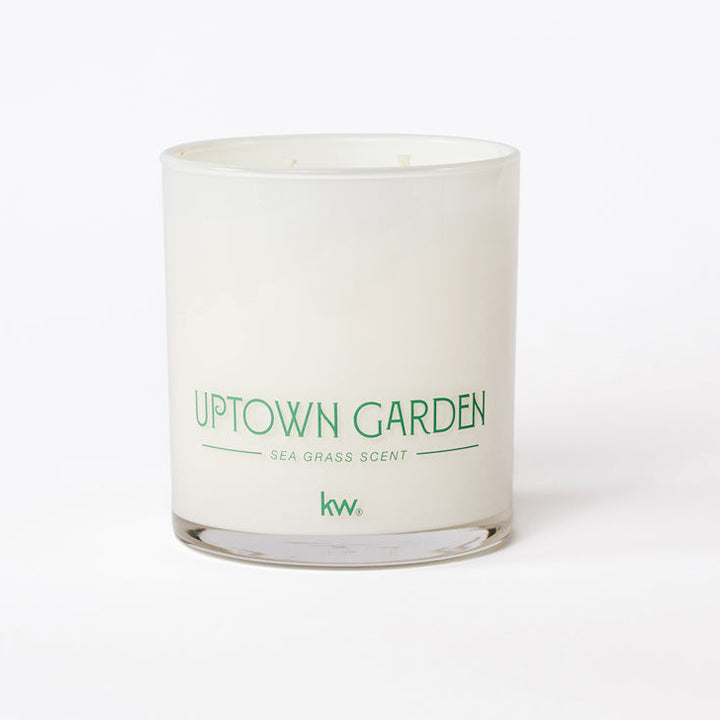Candle with 'Uptown Garden' text on a white background